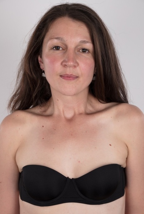 First timer Petra holds her face firm as she takes off her clothes