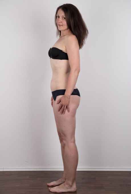 First timer Petra holds her face firm as she takes off her clothes