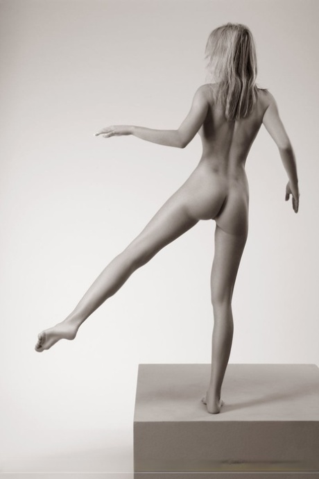 Beautiful blonde model Lia blindfolds herself while posing totally nude