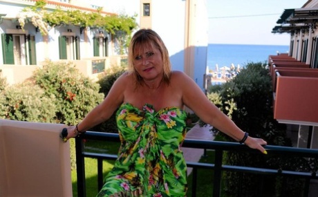 Slutty mature nudist with large tits Chrissy shows her hot curves at the beach