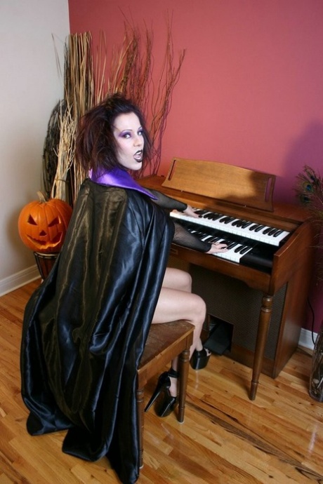 Solo girl Kream releases her enhanced tits while dressed up for Halloween