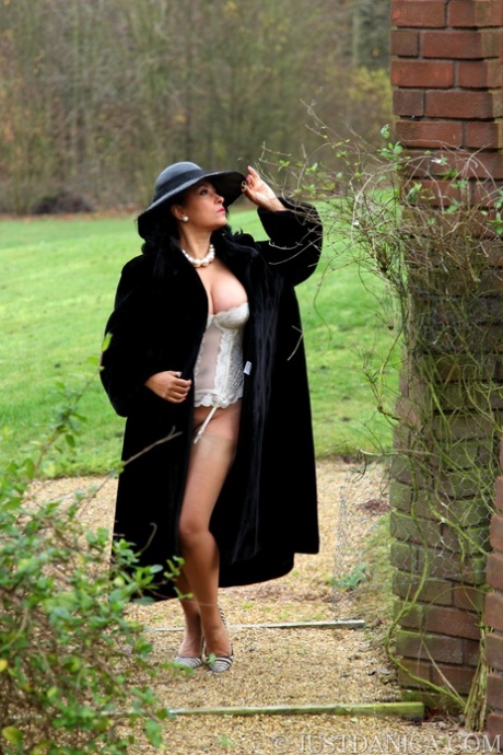 Classy mature woman Danica Collins frees big tits and butt from fur coat
