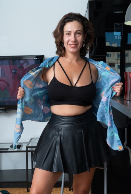 Busty amateur Gadget disrobes in the kitchen before playing with her beaver