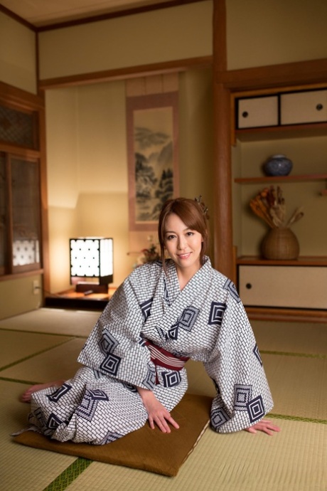 Japanese beauty Akari Asayiri teases in a kimono as well as a summer dress