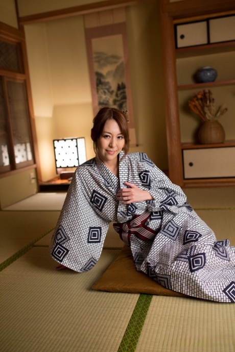 Japanese beauty Akari Asayiri teases in a kimono as well as a summer dress