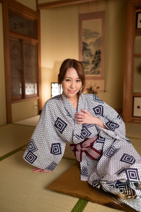 Japanese beauty Akari Asayiri teases in a kimono as well as a summer dress