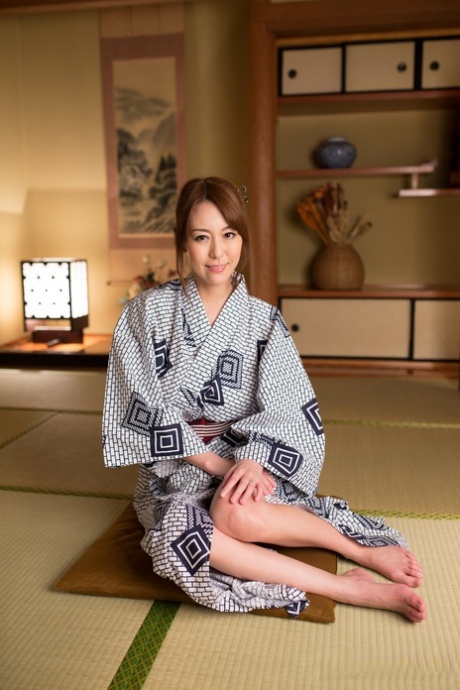 Japanese beauty Akari Asayiri teases in a kimono as well as a summer dress