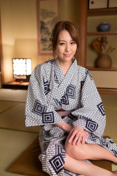 Japanese beauty Akari Asayiri teases in a kimono as well as a summer dress