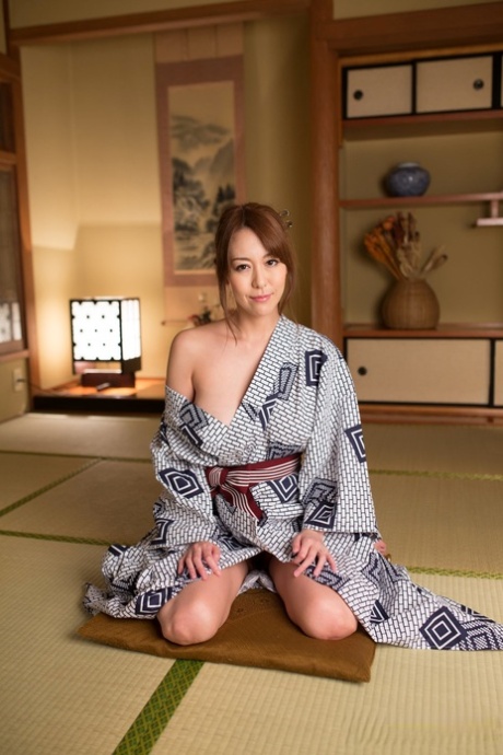Japanese beauty Akari Asayiri teases in a kimono as well as a summer dress