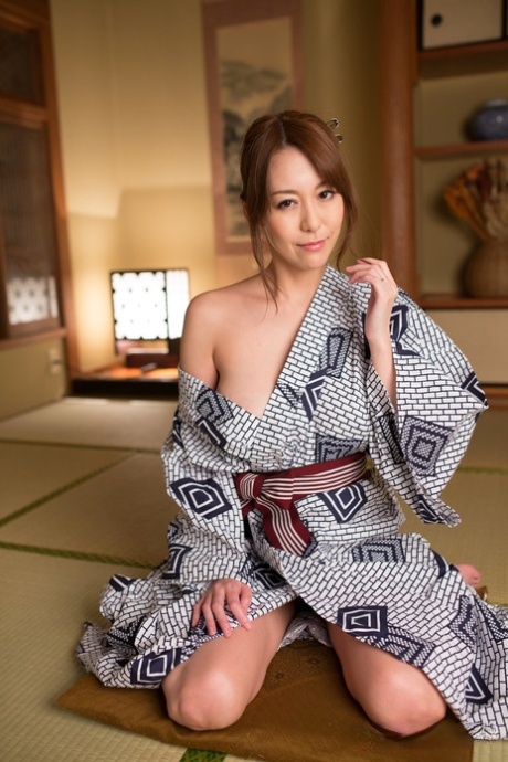 Japanese beauty Akari Asayiri teases in a kimono as well as a summer dress