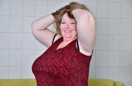 British BBW sets her saggy old boobs free in mesh nylons and black boots