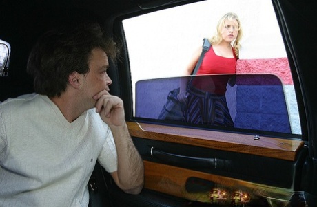 Juggy blonde MILF goes down on a big boner on the back seat