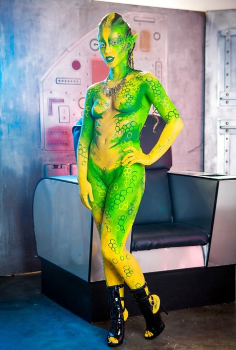 Kinky cosplay chick Tiffany Doll posing in body paint uniform and spreading