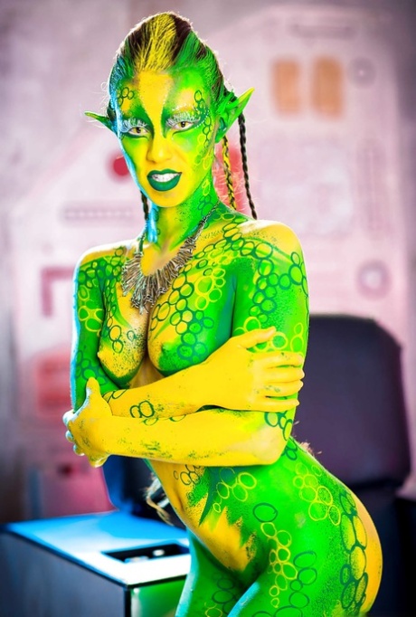 Kinky cosplay chick Tiffany Doll posing in body paint uniform and spreading
