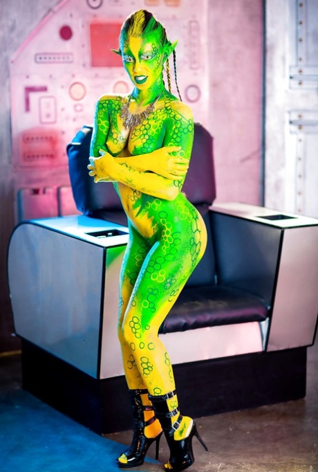 Kinky cosplay chick Tiffany Doll posing in body paint uniform and spreading