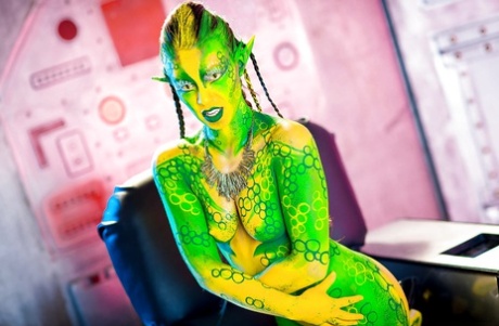 Kinky cosplay chick Tiffany Doll posing in body paint uniform and spreading