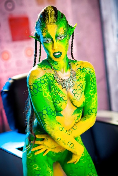 Kinky cosplay chick Tiffany Doll posing in body paint uniform and spreading