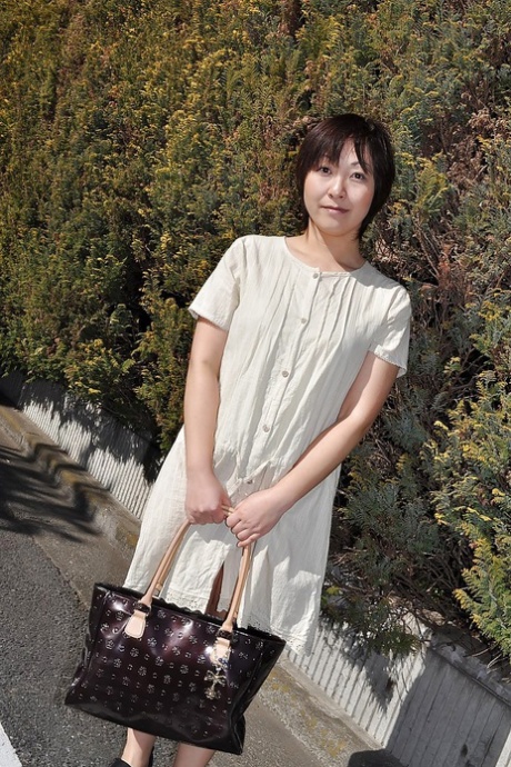 Chubby asian MILF Masae Shimatani undressing and playing with herself