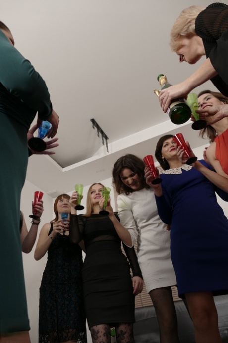 Nine horny European women sharing one big cock in a frenzied sex party
