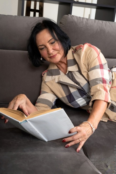 Black haired granny Olivia Westervelt playing with her shaved pussy