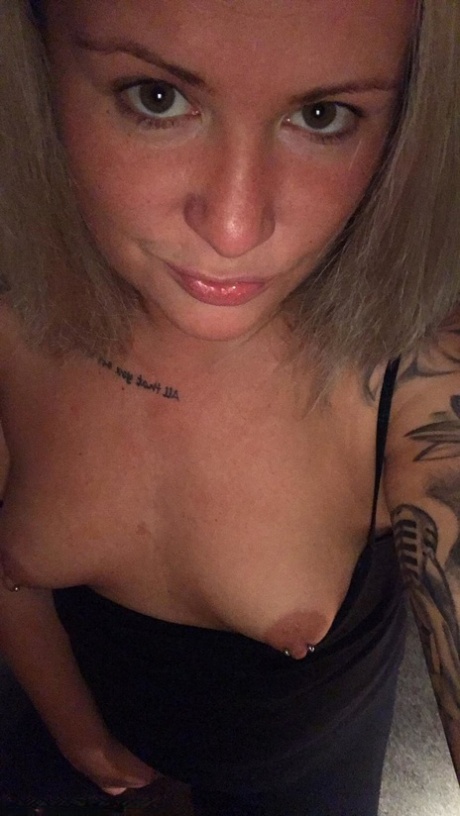 Amateur Kinky Hotwife strips and shows her tiny tits with pierced nipples