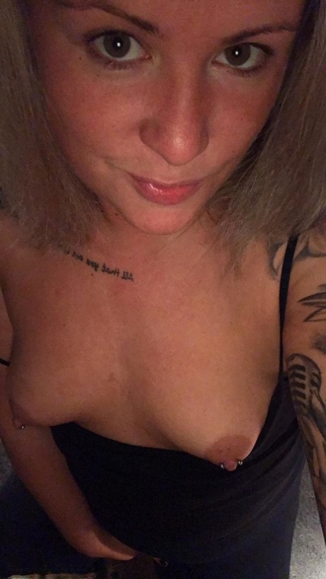 Amateur Kinky Hotwife strips and shows her tiny tits with pierced nipples