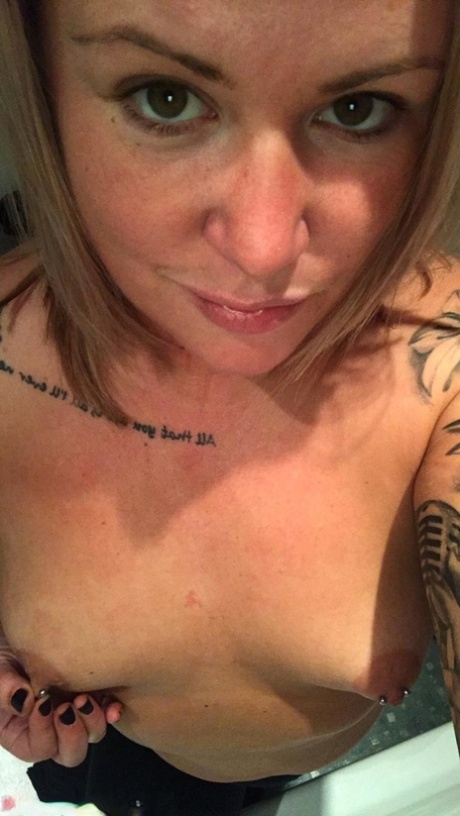 Amateur Kinky Hotwife strips and shows her tiny tits with pierced nipples