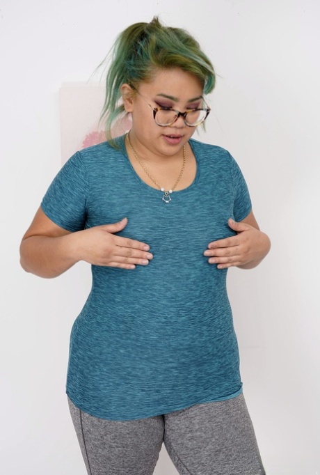 Chubby Asian babe Manila Bey unveils her big saggy tits and huge ass