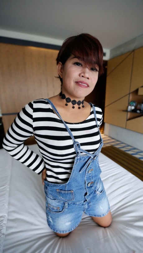 Short-haired Asian MILF Leni shows her big tits as she gets fucked in POV