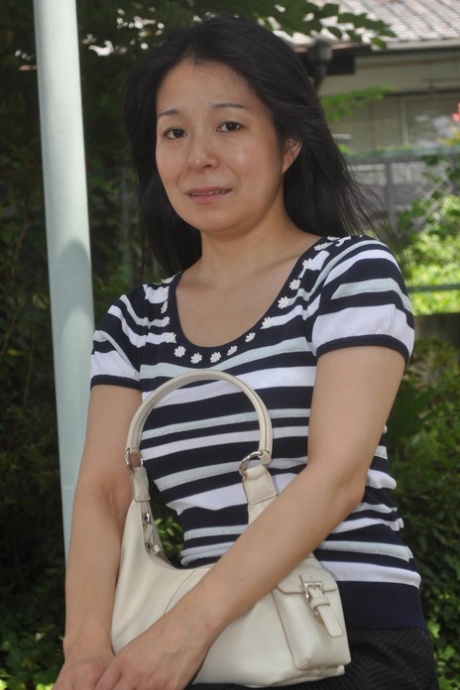 Petite Japanese granny Akiko Oda strips and shows her bushy wet beaver